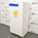 Three-quarter right-angled studio view of a Fisher Isotemp laboratory refrigerator model 17LREEFSA standing upright on a grey floor against a branded backdrop, showing its white exterior housing, front door with vertical handle, Fisher Scientific branding, and caution notices