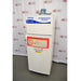 An alternative angled view of a Fisher Scientific Isotemp explosion-proof laboratory refrigerator/freezer combination unit, showing its white double-door exterior, warning labels, and top-mounted compressor housing.