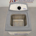 High-angle studio view of the Fisher Scientific M1800 1.9L ultrasonic bath with its lid removed, showing the open stainless steel interior tank with an "OPERATING LEVEL" fill line and the rear control panel with a mechanical timer knob
