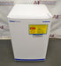 White Fisherbrand Isotemp undercounter general-purpose laboratory refrigerator freezer with yellow safety warning labels on the front door.
