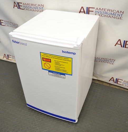 High-angle perspective view of a white Fisherbrand Isotemp undercounter general-purpose laboratory unit showing the top and front door with safety warning labels.