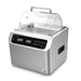 Front-angled studio view of the Four E's USA 13L Per4mance stainless steel water bath with a single clear gable cover, front digital LED display panel, side handle, and drain valve on a white background