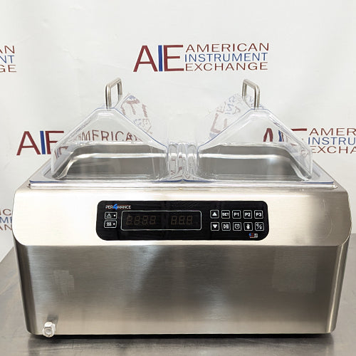 Front view of Four E's USA 24L Per4mance stainless steel water bath with dual transparent gable covers and digital control panel against an American Instrument Exchange background backdrop