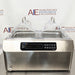 Front view of Four E's USA 24L Per4mance stainless steel water bath with dual transparent gable covers and digital control panel against an American Instrument Exchange background backdrop