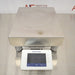 A front-facing overhead view of a Mettler Toledo XSR32001DR laboratory balance available from American Instrument Exchange, showing its large weighing pan and front-mounted digital touchscreen display.