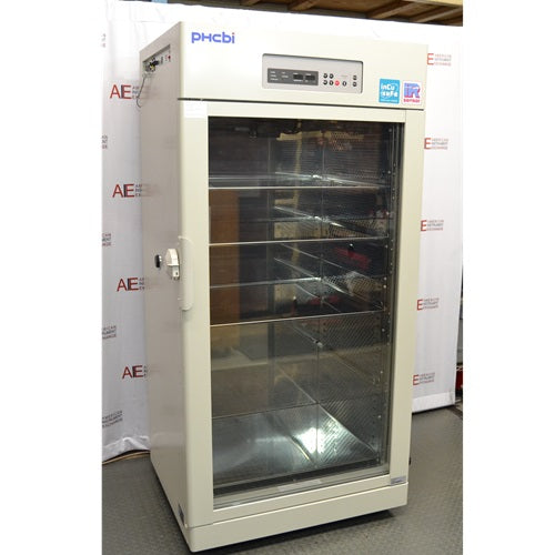 A front-facing view of a PHCbi CryoGrow MCO-80ICL-PA large capacity CO₂ incubator available from American Instrument Exchange, showing its full-length glass door, interior shelving, and top-mounted digital control panel.