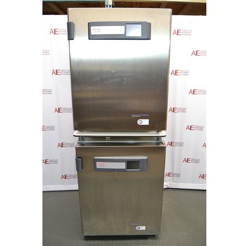 A front-facing view of two stacked stainless steel Thermo Scientific Heracell VIOS 250i CR CO2 incubators available from American Instrument Exchange, showing their control panels.