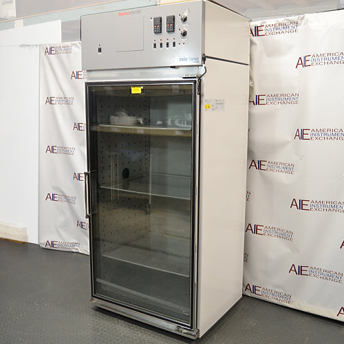 A front-facing view of a Thermo Forma 3940 refrigerated environmental chamber available from American Instrument Exchange, featuring a glass door and top control panel.
