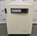 A front-facing view of a Thermo Heracell VIOS 250i copper-lined incubator available from American Instrument Exchange, showing its solid outer door, central branding panel, and digital display interface.