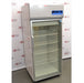 A front-facing view of a Thermo Scientific TSX3005GA high-performance lab refrigerator available from American Instrument Exchange, showing its glass door, internal wire shelving, and top-mounted digital control panel.