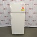 A front-facing view of a VWR explosion-proof refrigerator/freezer combination unit, showing its white double-door exterior, recessed side handles, and safety warning labels.