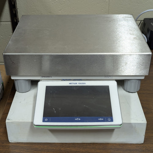 Front view of Mettler Toledo XPR32001L precision balance with stainless steel weighing platform and touchscreen terminal