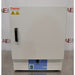 A front-facing view of a Thermo Scientific PR305225G Precision laboratory oven sitting on a metal surface, featuring a solid white door with a vertical black handle, Thermo Scientific logo, warning icons, and a blue bottom control panel with a power switch and control knob.