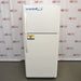 A front-facing view of a white VWR general purpose laboratory refrigerator/freezer combo in front of an American Instrument Exchange backdrop, featuring a top freezer compartment, bottom refrigerator compartment, vertical door handles, and a yellow caution label.