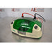 An elevated front-right view of a Bio-Rad MicroRotofor Cell unit set on a stainless steel tabletop, displaying the green protective cover, connected red and black power leads, power rocker switch, and American Instrument Exchange background banner.