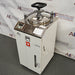 High-angle right perspective of Yamato Scientific SM510 vertical steam sterilizer autoclave with top clamp lid
