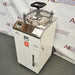 High-angle perspective of Yamato Scientific SM511 vertical steam sterilizer autoclave with top clamp lid