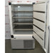 The interior of an open Thermo Scientific RDE60086FA ultra-low temperature freezer, displaying horizontal stainless steel shelving and interior door panels, positioned in front of an American Instrument Exchange backdrop.