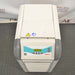 A Julabo FL601 recirculating chiller, with a gray body and blue details, standing on a warehouse floor.