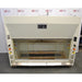 A front-facing view of a Kewaunee 6-foot chemical fume hood, featuring a cream-colored exterior, sliding glass sash, and side-mounted utility controls with colorful knobs, positioned in front of an American Instrument Exchange backdrop.