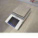 Left-side perspective view of the Mettler Toledo XPE2002S precision balance displaying the touchscreen controller angled towards the front and the stainless steel weighing pan.