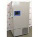 A left-side angled view of the grey Thermo Scientific RDE60086FA ultra-low temperature freezer, displaying the side-mounted handle, blue control panel, and front ventilation grille against an American Instrument Exchange backdrop.