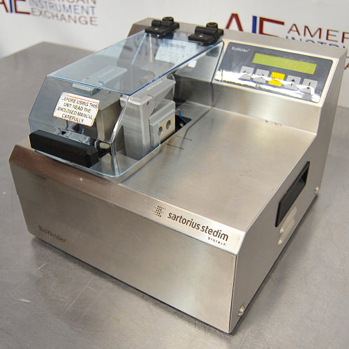 Left-side angled view of Sartorius Stedim BioWelder automated tubing welder with clear protective cover