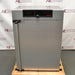 Front exterior view of a closed Memmert HPP260 climate chamber showing the textured stainless steel finish, vertical door handle, and top digital control panel.