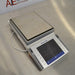 Angled view of a Mettler Toledo XPE6002S precision balance showing the stainless steel weighing pan and front touchscreen terminal.