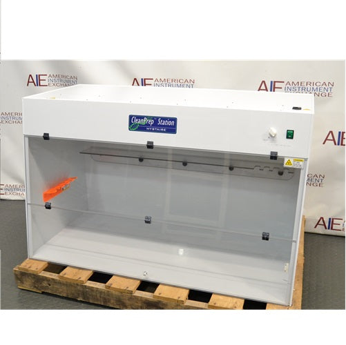 Straight-on front view of a Mystaire CleanPrep Station PCR workstation on a wooden pallet showing the internal rear shelf and sash window.