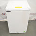 Compact white Norlake undercounter laboratory freezer with a solid front door and key lock.