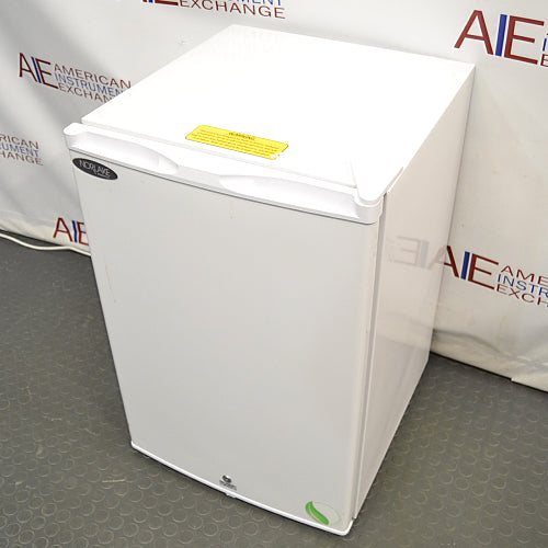 Compact white Norlake undercounter laboratory freezer with a solid front door and key lock.