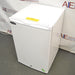 Compact white Norlake undercounter laboratory freezer with a solid front door and key lock.