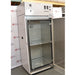 An angled open-door view of a Thermo Forma 3940 refrigerated environmental chamber in front of an American Instrument Exchange backdrop, highlighting the open outer door, internal glass door, shelf interior, and top grey control console.