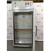 A straight-on open-door view of a Thermo Forma 3940 refrigerated environmental chamber in front of an American Instrument Exchange backdrop, displaying the open outer door, inner glass door, interior stainless steel chamber with shelving, and top grey control console.