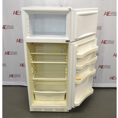 A front-angled view of a white Thermo Scientific 10FCEETSA flammable material combination refrigerator/freezer with both doors open, displaying the upper freezer compartment and the lower refrigerator interior with wire shelves, bottom storage bin, and door racks against an American Instrument Exchange backdrop.