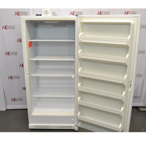 A full front view of an open white Thermo Scientific 3552-10A flammable material storage freezer, displaying the interior wire shelf compartments, bottom wire basket, and multiple door storage racks against an American Instrument Exchange backdrop.