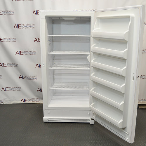 Open upright white VWR general purpose laboratory freezer showing interior wire shelves and door racks