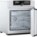 Open Memmert UF110plus laboratory oven showing interior stainless steel chamber and TwinDISPLAY control panel
