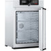 Open Memmert UF160plus laboratory oven showing interior stainless steel chamber and TwinDISPLAY control panel