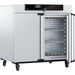 Open Memmert UF450 laboratory oven showing interior stainless steel chamber and SingleDISPLAY control panel