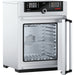 Open Memmert UF55plus laboratory oven showing interior stainless steel chamber and TwinDISPLAY control panel