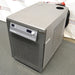 A PolyScience high-capacity recirculating chiller, with a digital display and control panel, in a laboratory setting.