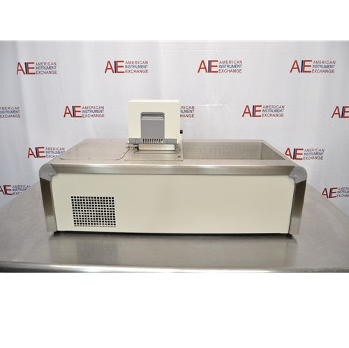 A rear view of a Thermo Scientific A10B refrigerated bath circulator sitting on a stainless steel surface against an American Instrument Exchange backdrop, showing the back casing with square ventilation grid, stainless steel edge trim, top bath opening, and the rear housing of the digital control head.