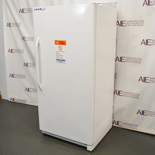 Right-angled view of an upright white VWR general purpose laboratory freezer with front warning label