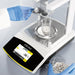 A gloved laboratory technician using a metal scoop to dispense white tablets into a glass beaker inside the draft shield chamber of a Sartorius Secura 120 analytical balance displaying a parts counting readout.