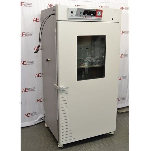 Angled front-right view of a closed, white Shel Lab 2428 CO2 incubator showing the glass window and right side panel.