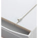 Close-up of the spring pusher glider mechanism on a grey retail shelf tray.