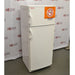 An angled side view of a white Thermo Scientific 10FCEETSA flammable material combination refrigerator/freezer on a lab floor, showing the top freezer compartment with a flammable storage safety label, the main refrigerator compartment below, and side door handles against an American Instrument Exchange backdrop.