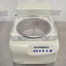 Slight high-angle front view of Eppendorf Vacufuge Plus 5305 centrifugal vacuum concentrator showing central spindle through clear top lid